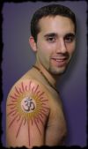 guy with om tattoo